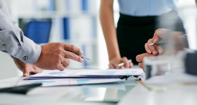hands of business people working with documents